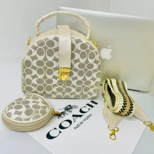 BOLSO DE MANO TIPO BAUL COACH