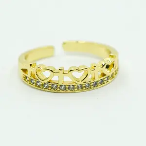 ANILLO DORADO CORAZONES Y CRUCES
