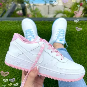 NIKE CINTAS FLORES