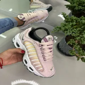 nike tailwind rosa mujer