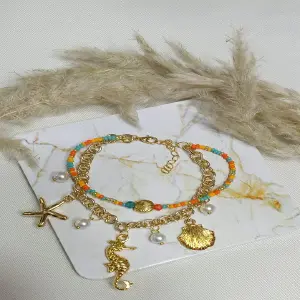 pulsera en rodio con dijes
