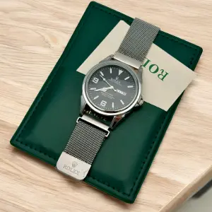 Reloj Rolex en malla doble calendario