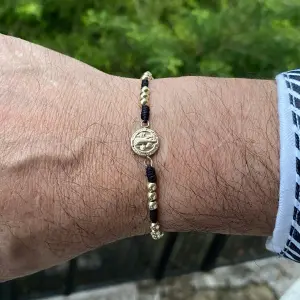 Pulsera San Benito en Oro laminado 18K