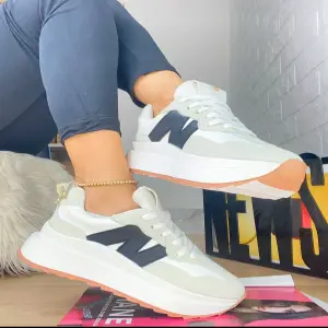 Tenis N azul con gris