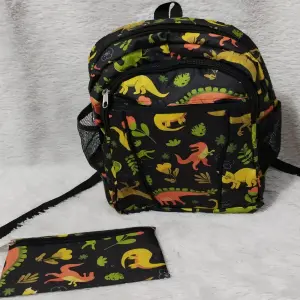 BOLSO DINOSAURIO VERDE Y AZUL
