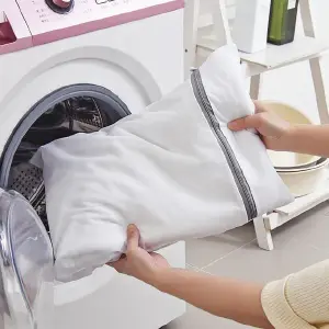 Bolsa plegable con cierre para lavadora.