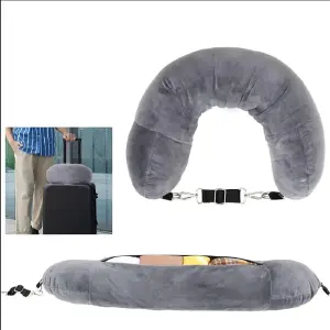 almohada de cuello y maleta de viaje