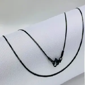 Cadena Negra Plana 0.5mm: Elegancia y Resistencia - Cadena Negra Plana 0.5mm